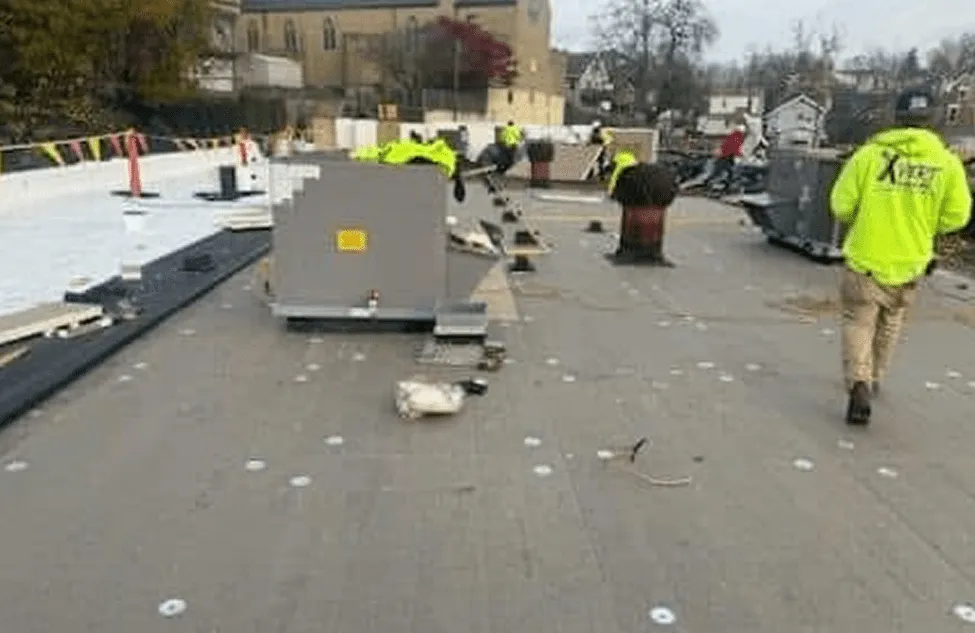 Xpert Roofing crew working on a commercial flat roof