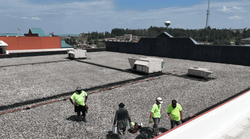 The Xpert Roofing crew on a gravel commercial roof